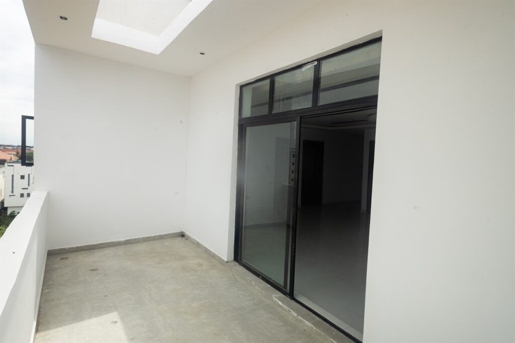 Brum Height 5: Covered balcony beside sliding glass doors